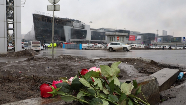 Flowers are seen left at the scene of the gun attack at the Crocus City Hall concert hall in Krasnogorsk, outside Moscow, on March 23, 2024. Gunmen who opened fire at a Moscow concert hall killed more than 60 people and wounded over 100 while sparking an inferno, authorities said on March 23, 2024, with the Islamic State group claiming responsibility. (Photo by STRINGER / AFP)