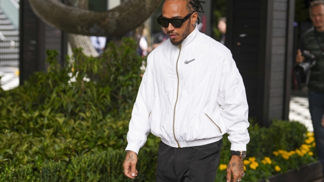 Mercedes driver Lewis Hamilton of Britain arrives at the track ahead of the third practice session of the Australian Formula One Grand Prix at Albert Park, in Melbourne, Australia, Saturday, March 23, 2024. (AP Photo/Scott Barbour)