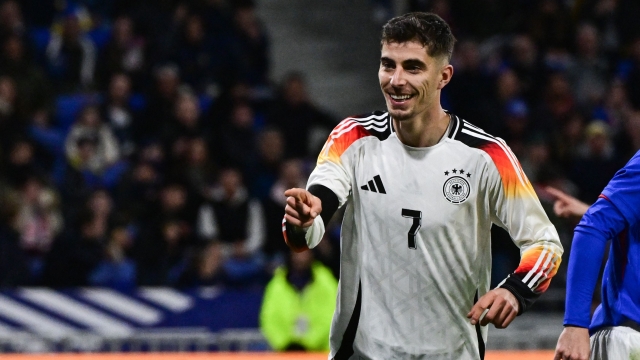 Germany's midfielder #07 Kai Havertz (R) celebrates after scoring Germany's second goal during the friendly football match between France and Germany, at the Groupama Stadium in Decines-Charpieu, near Lyon, on March 23, 2024. (Photo by Olivier CHASSIGNOLE / AFP)