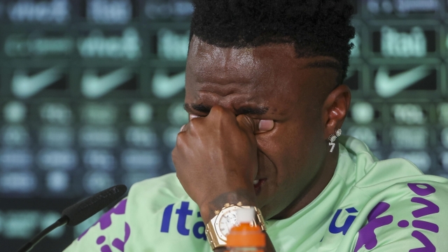 epa11243026 Brazil player Vinicius Junior sheds a tear as he attends a press conference in Madrid, Spain, 25 March 2024. Real Madrid player Vinicius Jr was asked by the media about the racist abuse he has been suffering over the last few years in Spain. Brazil is to face Spain in a friendly match on 26 March.  EPA/Kiko Huesca