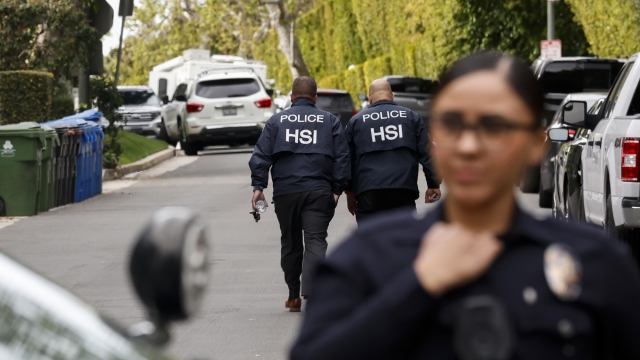 epaselect epa11243745 Federal investigators walk on a closed off road outside of a home owned by rapper and record producer Sean 'Diddy' Combs in Los Angeles, California, USA, 25 March 2024. The United States' Department of Homeland Security confirmed that the raid on Combs home was part of an ongoing investigation.  EPA/CAROLINE BREHMAN