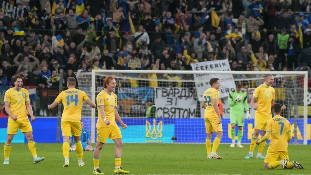 Ukraine players celebrate at the end of the Euro 2024 qualifying play-off soccer match between Ukraine and Iceland, at the Tarczynski Arena Wroclaw in Wroclaw, Poland, Tuesday, March 26, 2024. (AP Photo/Czarek Sokolowski)