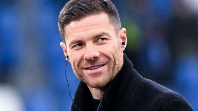 (FILES) Bayer Leverkusen's Spanish head coach Xabi Alonso is interviewed prior to the German first division Bundesliga football match between SV Darmstadt 98 and Bayer 04 Leverkusen in Darmstadt, western Germany on February 3, 2024. Xabi Alonso, who was seen by many as Liverpool's top target to replace Jurgen Klopp as their manager, said on March 29, 2024 he is staying at Bundesliga leaders Bayer Leverkusen next season. (Photo by Kirill KUDRYAVTSEV / AFP)