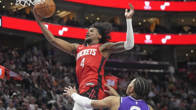 Houston Rockets guard Jalen Green (4) goes to the basket as Utah Jazz guard Keyonte George (3) defends during the second half of an NBA basketball game Friday, March 29, 2024, in Salt Lake City. (AP Photo/Rick Bowmer)