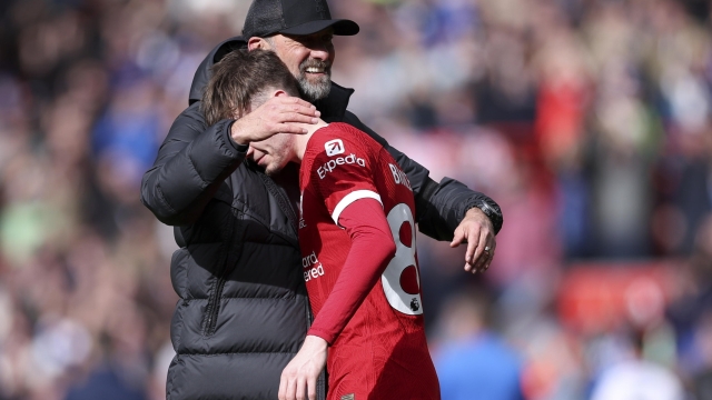 epa11253299 Liverpoolâ??s manager Juergen Klopp hugs his player Conor Bradley after winning the English Premier League match between Liverpool and Brighton & Hove Albion in Liverpool, Britain, 31 March 2024.  EPA/ADAM VAUGHAN EDITORIAL USE ONLY. No use with unauthorized audio, video, data, fixture lists, club/league logos, 'live' services or NFTs. Online in-match use limited to 120 images, no video emulation. No use in betting, games or single club/league/player publications.
