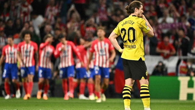 Dortmund's Austrian midfielder #20 Marcel Sabitzer (R) reacts after Atletico Madrid's Brazilian forward #12 Samuel Lino scores his team's second goal during the UEFA Champions League quarter final first leg football match between Club Atletico de Madrid and Borussia Dortmund at the Metropolitano stadium in Madrid on April 10, 2024. (Photo by JAVIER SORIANO / AFP)