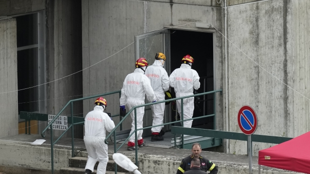 Fire fighters work at the scene of an explosion that occurred at the Enel Green Power hydroelectric plant at the Suviana Dam, some 70 kilometres southwest of Bologna, Italy, Wednesday, April 10, 2024. Search and rescue operations were still under way on Wednesday morning at a decades-old hydroelectric plant close to the northern Italian city of Bologna, after a devastating blast a day before killed at least three workers, injured five, and left four missing. Wednesday, April 10, 2024. (AP Photo/Antonio Calanni)