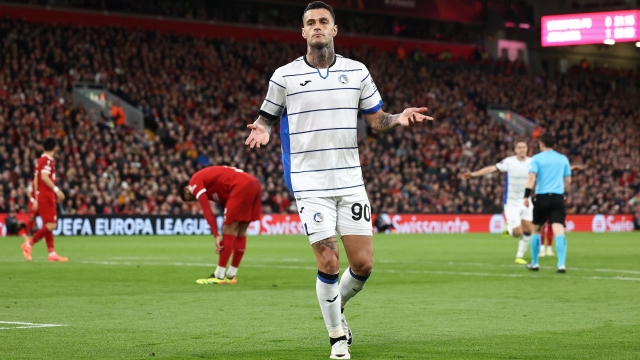 Atalanta's Italian forward #90 Gianluca Scamacca celebrates scoring the team's second goal during the UEFA Europa League quarter-final first leg football match between Liverpool and Atalanta at Anfield in Liverpool, north west England on April 11, 2024. (Photo by Darren Staples / AFP)
