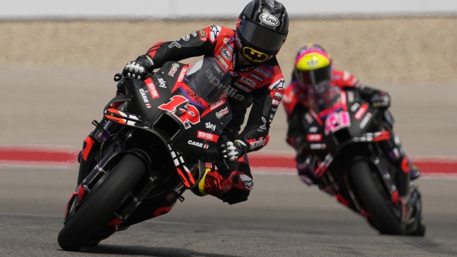 MotoGP rider Maverick Vinales (12), of Spain, steers through a turn during qualifying for the MotoGP Grand Prix of the Americas motorcycle race at the Circuit of the Americas, Saturday, April 13, 2023, in Austin, Texas. (AP Photo/Eric Gay)