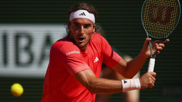 Stefanos Tsitsipas, of Greece returns the ball to Jannik Sinner, of Italy during their Monte Carlo Tennis Masters semifinal match in Monaco, Saturday, April 13, 2024. (AP Photo/Daniel Cole)