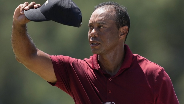 Tiger Woods waves after his final round at the Masters golf tournament at Augusta National Golf Club Sunday, April 14, 2024, in Augusta, Ga. (AP Photo/David J. Phillip)