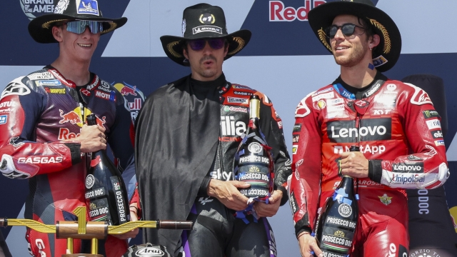 epa11279116 (L-R) Second placed Spanish rider Pedro Acosta of the Red Bull GASGAS Tech3 Team, winner Spanish rider Maverick Vinales of the Aprilia Racing Team, and third placed Italian rider Enea Bastianini of the Ducati Lenovo Team celebrate on the podium after the MotoGP race for the Motorcycling Grand Prix of The Americas at the Circuit of The Americas in Austin, Texas, USA, 14 April 2024.  EPA/ADAM DAVIS
