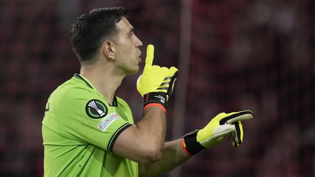 Aston Villa's goalkeeper Emiliano Martinez reacts during the penalties in the Europa Conference League quarter final second leg soccer match between Lille and Aston Villa at the Pierre Mauroy stadium in Villeneuve d'Ascq, northern France, Thursday, April 18, 2024. Aston Villa is in semi finals as beat Lille in penalties 4-3. (AP Photo/Christophe Ena)