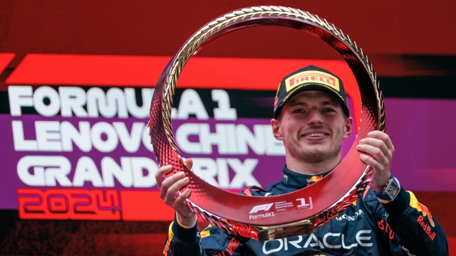 epaselect epa11291211 Red Bull Racing driver Max Verstappen of the Netherlands celebrates with his trophy after winning the Formula One Chinese Grand Prix, in Shanghai, China, 21 April 2024. The 2024 Formula 1 Chinese Grand Prix is held at the Shanghai International Circuit racetrack on 21 April after a five-year hiatus.  EPA/ALEX PLAVEVSKI