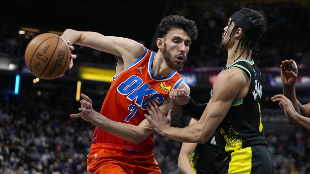 Oklahoma City Thunder forward Chet Holmgren (7) makes a pass in front of Indiana Pacers guard Andrew Nembhard (2) during the first half of an NBA basketball game in Indianapolis, Friday, April 5, 2024. (AP Photo/Darron Cummings)
