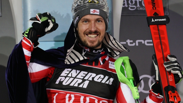 FILE - Austria's Marcel Hirscher celebrates on the podium after winning an alpine ski, men's World Cup slalom in Zagreb, Croatia, Sunday, Jan. 6, 2019. Marcel Hirscher, one of the most successful ski racers of all time, is planning to return next season after five years in retirement. And the record eight-time overall World Cup champion is going to compete for the Netherlands ? his mother's country ? instead of his native Austria. (AP Photo/Giovanni Auletta, File)