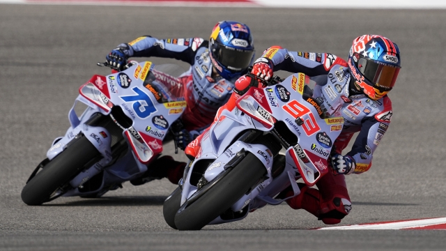 MotoGP rider Marc Marquez (93), of Spain, and Alex Marquez (73), of Spain, steer through a turn during a practice session for the MotoGP Grand Prix of the Americas motorcycle race at the Circuit of the Americas, Saturday, April 13, 2023, in Austin, Texas. (AP Photo/Eric Gay)