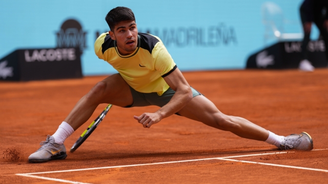 Carlos Alcaraz, of Spain, competes with Alexander Shevchenko, of Kazakhstan, during the Mutua Madrid Open tennis tournament in Madrid, Friday, April 26, 2024. (AP Photo/Manu Fernandez)