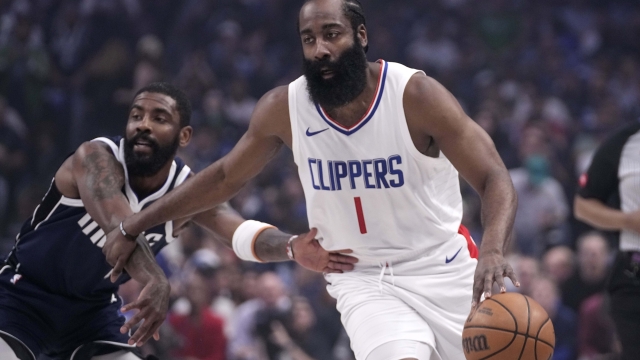 Los Angeles Clippers' James Harden (1) drives against Dallas Mavericks' Kyrie Irving during the first half of Game 2inf an NBA basketball first-round playoff series Friday, April 26, 2024, in Dallas. (AP Photo/Tony Gutierrez)