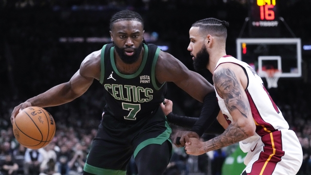 Boston Celtics guard Jaylen Brown (7) sets to drive against Miami Heat forward Caleb Martin during the first half of Game 5 of an NBA basketball first-round playoff series, Wednesday, May 1, 2024, in Boston. (AP Photo/Charles Krupa)