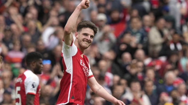 Arsenal's Declan Rice celebrates after scoring his side's third goal during the English Premier League soccer match between Arsenal and Bournemouth at Emirates Stadium in London, England, Saturday, May 4, 2024. (AP Photo/Frank Augstein)