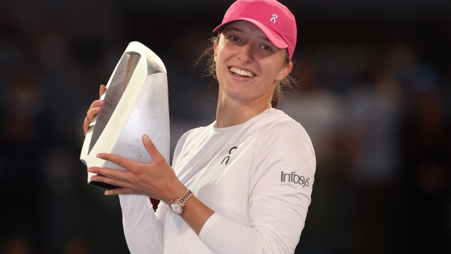 MADRID, SPAIN - MAY 04: Iga Swiatek of Poland poses for a photo with the trophy after victory against Aryna Sabalenka of Belarus following their Women's Singles Final match on Day Twelve of Mutua Madrid Open at La Caja Magica on May 04, 2024 in Madrid, Spain. (Photo by Julian Finney/Getty Images)