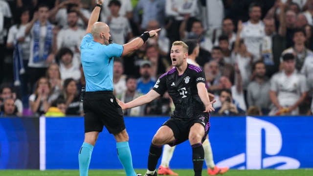 MADRID, SPAIN - MAY 08: Referee Szymon Marciniak disallows a goal as Matthijs de Ligt of Bayern Munich reacts during the UEFA Champions League semi-final second leg match between Real Madrid and FC Bayern München at Estadio Santiago Bernabeu on May 08, 2024 in Madrid, Spain. (Photo by David Ramos/Getty Images)