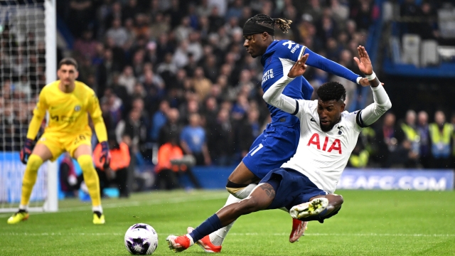 LONDON, ENGLAND - MAY 02: Emerson of Tottenham Hotspur is challenged by Noni Madueke of Chelsea during the Premier League match between Chelsea FC and Tottenham Hotspur at Stamford Bridge on May 02, 2024 in London, England. (Photo by Mike Hewitt/Getty Images)