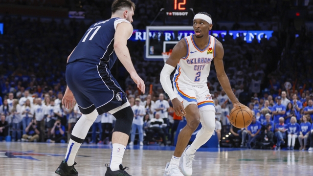 Oklahoma City Thunder guard Shai Gilgeous-Alexander (2) works the floor against Dallas Mavericks guard Luka Doncic during the second half of Game 1 of an NBA basketball second-round playoff series, Tuesday, May 7, 2024, in Oklahoma City. The Thunder won 117-95. (AP Photo/Nate Billings)
