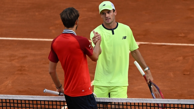 ROME, ITALY - MAY 14: Tommy Paul of United States (R) embraces Daniil Medvedev following victory in their Men's Singles Fourth Round Match on Day Nine of Internazionali BNL D'Italia at Foro Italico on May 14, 2024 in Rome, Italy. (Photo by Mike Hewitt/Getty Images)