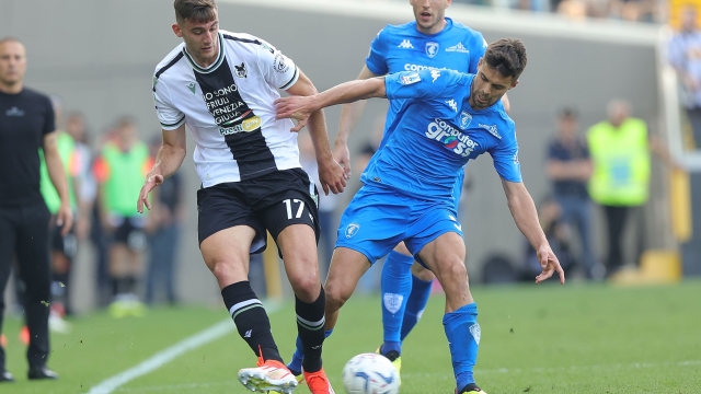 UDINE, ITALY - MAY 19: Lorenzo Lucca of Udinese Calcio battles for the ball with Alberto Grassi of Empoli FC during the Serie A TIM match between Udinese Calcio and Empoli FC at Dacia Arena on May 19, 2024 in Udine, Italy.(Photo by Gabriele Maltinti/Getty Images)