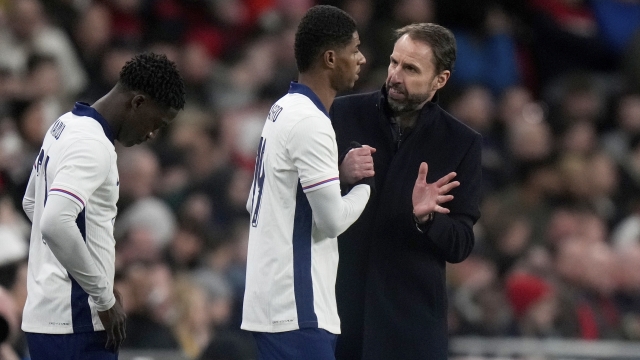 England coach Gareth Southgate spekas to England's Marcus Rashford replacing teammate England's Anthony Gordon during a friendly soccer match between England and Brazil at Wembley Stadium in London, Saturday, March 23, 2024. (AP Photo/Alastair Grant)