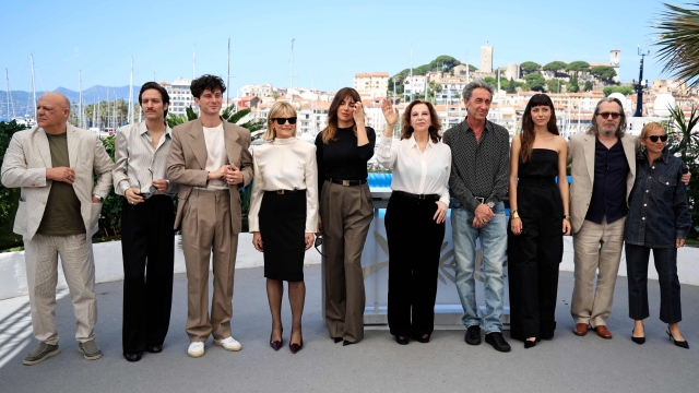 (FromL) Italian actor Peppe Lanzetta, Italian actor Dario Aita, Italian actor Daniele Rienzo, Italian actress Isabella Ferrari, Italian actress Luisa Ranieri, Italian actress Stefania Sandrelli, Italian director Paolo Sorrentino, Italian actress Celeste Dalla Porta, British actor Gary Oldman and Daniela Sorrentino pose during a photocall for the film "Parthenope" at the 77th edition of the Cannes Film Festival in Cannes, southern France, on May 22, 2024. (Photo by Valery HACHE / AFP)