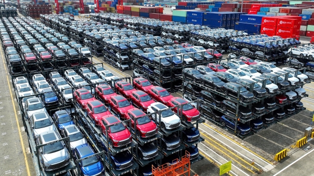(FILES) This photo taken on September 11, 2023, shows BYD electric cars awaiting to be loaded onto a ship at the international container terminal of Taicang Port at Suzhou Port, in China’s eastern Jiangsu Province. Struggling foreign automakers in China are looking for help from local tech giants to try and stay competitive in the world's biggest electric car market, where shiny smart screens, assisted driving and sophisticated map technology are in high demand. (Photo by AFP) / China OUT / To go with China-economy-auto-technology-EVs, FOCUS by Peter Catterall and Qasim Nauman