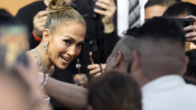 Jennifer Lopez, a cast member in "Atlas," interacts with fans at the premiere of the Netflix film at the Egyptian Theatre, Monday, May 20, 2024, in Los Angeles. (AP Photo/Chris Pizzello)