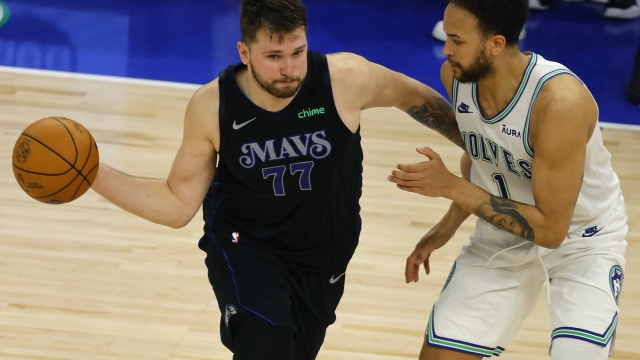 Dallas Mavericks guard Luka Doncic (77) drives against Minnesota Timberwolves forward Kyle Anderson (1) during the second half of Game 2 of the NBA basketball Western Conference finals, Friday, May 24, 2024, in Minneapolis. (AP Photo/Bruce Kluckhohn)