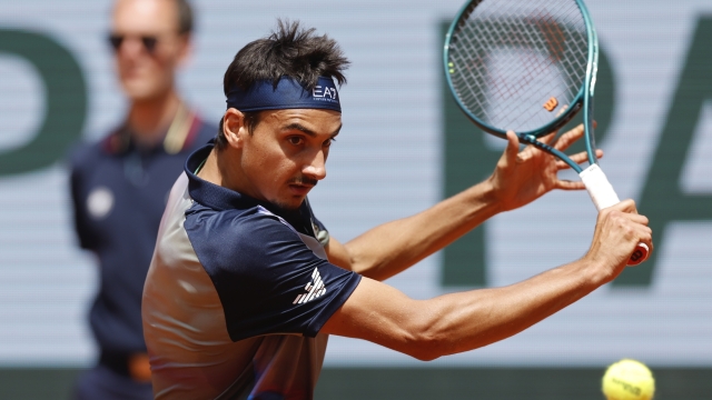 Italy's Lorenzo Sonego plays a shot against France's Ugo Humbert during their first round match of the French Open tennis tournament at the Roland Garros stadium in Paris, Sunday, May 26, 2024. (AP Photo/Jean-Francois Badias)