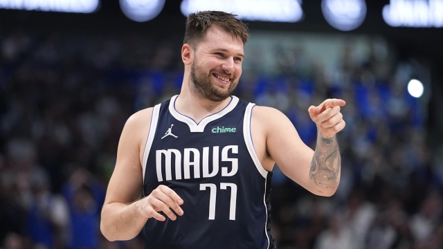 Dallas Mavericks guard Luka Doncic (77) reacts to a play during the second half in Game 3 of the NBA basketball Western Conference finals against the Minnesota Timberwolves, Sunday, May 26, 2024, in Dallas. (AP Photo/Julio Cortez)