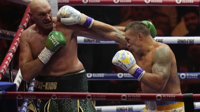 Britain's Tyson Fury, left, and Ukraine's Oleksandr Usyk trade blows during their undisputed heavyweight world championship boxing fight at the Kingdom Arena in Riyadh, Saudi Arabia, Sunday, May 19, 2024. (AP Photo/Francisco Seco)