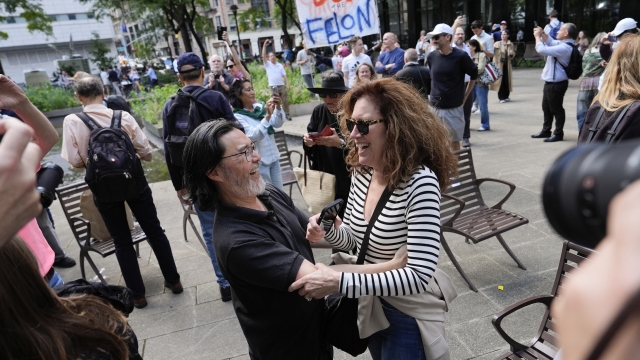 People react to the guilty verdict announced against former President Donald Trump outside Manhattan Criminal Court, Thursday, May 30, 2024, in New York. (AP Photo/Julia Nikhinson)