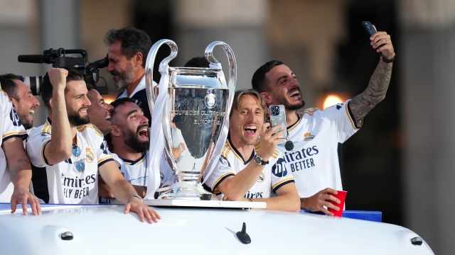 MADRID, SPAIN - JUNE 02: Daniel Carvajal, Luka Modric and Joselu of Real Madrid celebrate as team bus drives through the city during the Real Madrid UEFA Champions League Trophy Parade following their victory over Borussia Dortmund in the UEFA Champions League Final on June 02, 2024 in Madrid, Spain. (Photo by Angel Martinez/Getty Images)