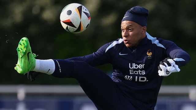 France's forward Kylian Mbappe controls the ball during a training session, as part of the team's preparation for upcoming UEFA Euro 2024 Football Championship, in Clairefontaine-en-Yvelines on May 30, 2024. The UEFA Euro 2024 championship will take place from June 14 to July 14, 2024 in Germany. (Photo by FRANCK FIFE / AFP)