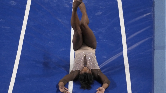 Simone Biles falls while competing on the vault during the U.S. Gymnastics Championships Sunday, June 2, 2024, in Fort Worth, Texas. (AP Photo/Tony Gutierrez)