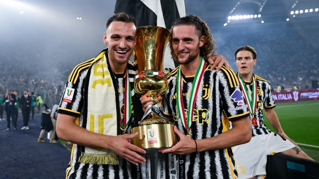 ROME, ITALY - MAY 15: Federico Gatti and Adrien Rabiot of Juventus celebrate the victory with the trophy after the Coppa Italia final match between Atalanta BC and Juventus FC at Olimpico Stadium on May 15, 2024 in Rome, Italy. (Photo by Daniele Badolato - Juventus FC/Juventus FC via Getty Images)