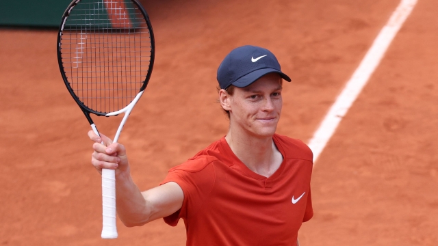 Italy's Jannik Sinner celebrates after winning against Bulgaria's Grigor Dimitrov at the end of their men's singles quarter final match on Court Philippe-Chatrier on day ten of the French Open tennis tournament at the Roland Garros Complex in Paris on June 4, 2024. (Photo by ALAIN JOCARD / AFP)