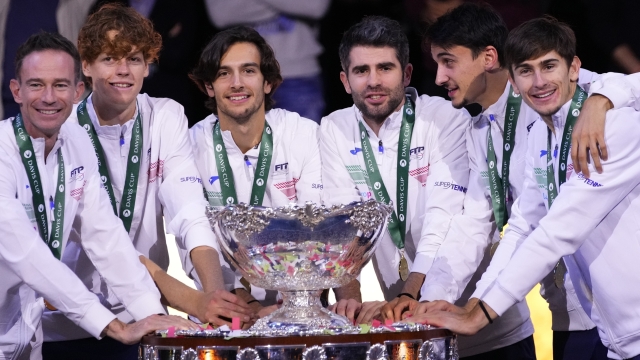 The Italian Davis Cup team pose with the trophy after defeating Australia during the Davis Cup final tennis matches in Malaga, Spain, Sunday, Nov. 26, 2023. Italy are the 2023 World Champions Davis Cup winners. (AP Photo/Manu Fernandez)