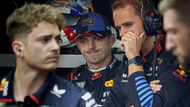 Red Bull Racing driver Max Verstappen, of the Netherlands, looks on as mechanics work on his car during the second practice session for the Formula 1 Canadian Grand Prix auto race Friday, June 7, 2024, in Montreal. (Paul Chiasson/The Canadian Press via AP)