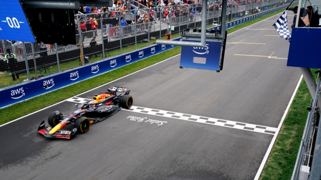 epa11400831 Red Bull Racing driver Max Verstappen of Netherlands crosses the finish line to win the Formula One Grand Prix of Canada, in Montreal, Canada, 09 June 2024.  EPA/SHAWN THEW / POOL
