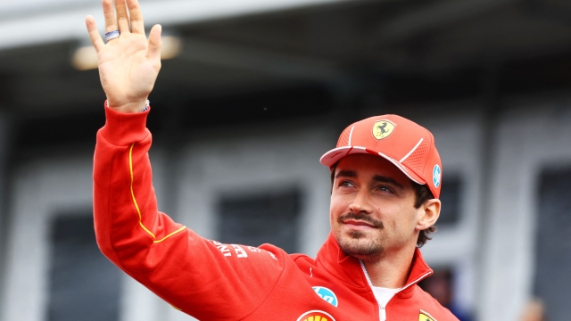 MONTREAL, QUEBEC - JUNE 09: Charles Leclerc of Monaco and Ferrari waves to the crowd on the drivers parade prior to the F1 Grand Prix of Canada at Circuit Gilles Villeneuve on June 09, 2024 in Montreal, Quebec.   Mark Thompson/Getty Images/AFP (Photo by Mark Thompson / GETTY IMAGES NORTH AMERICA / Getty Images via AFP)