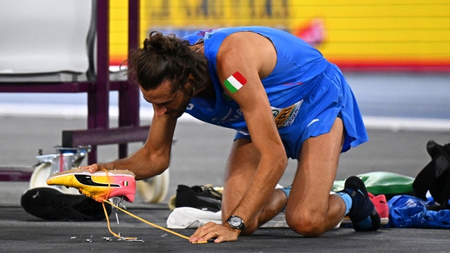 ROME, ITALY - JUNE 11: Gold medallist, Gianmarco Tamberi of Team Italy, empties springs from inside his trainer after winning in the Men's High Jump Final on day five of the 26th European Athletics Championships - Rome 2024 at Stadio Olimpico on June 11, 2024 in Rome, Italy.  (Photo by Mattia Ozbot/Getty Images for European Athletics)